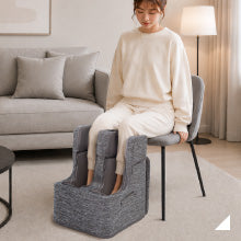 フットマッサージャーを使用する女性